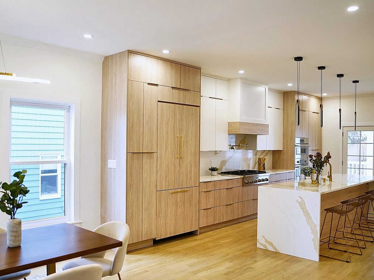 Slab-door kitchen — frameless matte white with rift oak accents
