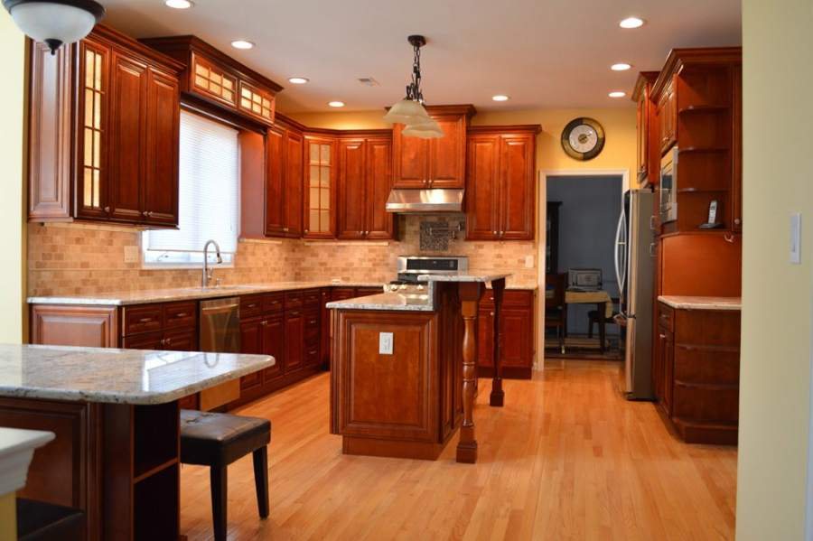 21st Century Charlton coffee-stained kitchen with a wood island — manufacturer photo
