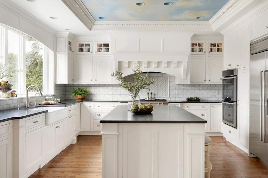 Crystal French Villa Square white kitchen with a black island top — Crystal Cabinets photo