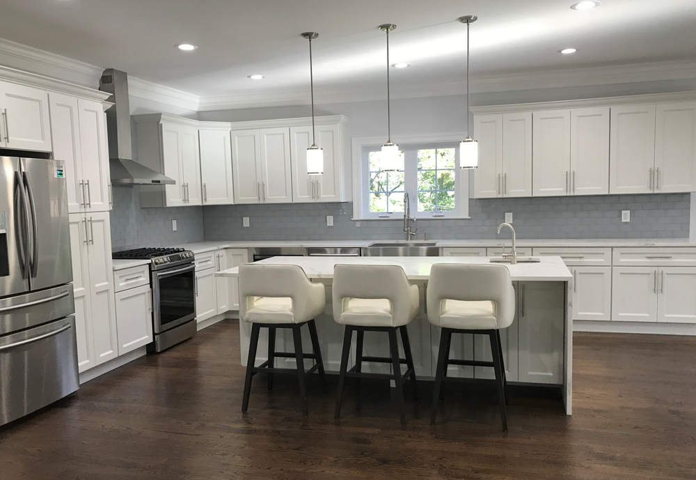 FGM white shaker kitchen with a grey island — manufacturer photo