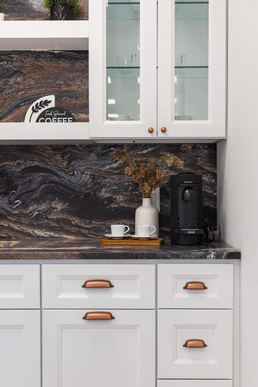 J&K B5 Pure coffee bar with a dark granite backsplash — manufacturer photo