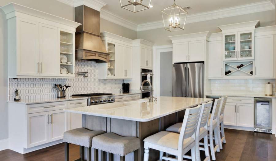Benton door in Alabaster with a Shelby island in Ash — Kith Kitchens photo