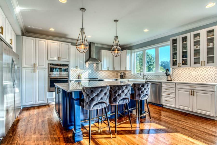 Hartford door in Bright White with a Smoky Blue island — Kith Kitchens photo