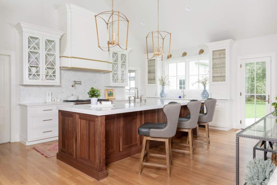 Natural walnut island with Polar maple uppers, beaded inset Square Flat doors — Shiloh photo