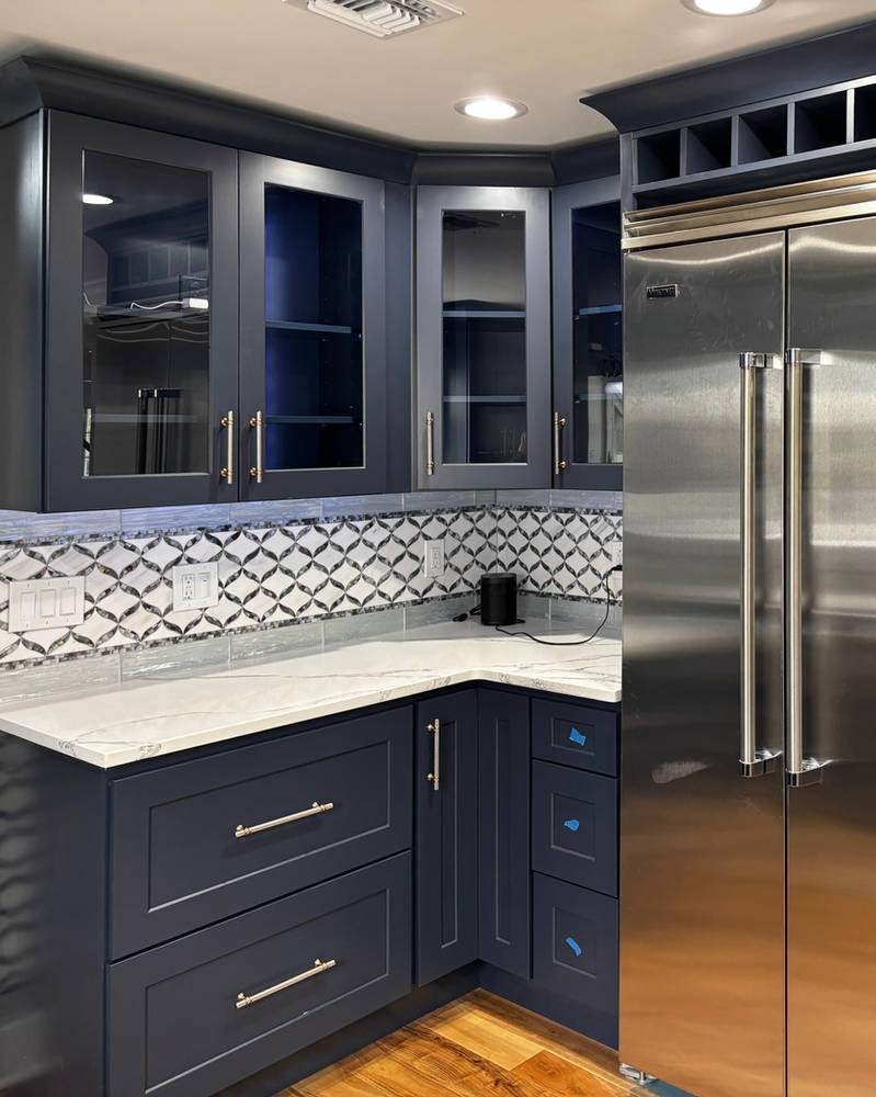 WoodConcept Element Ocean navy kitchen with glass uppers — manufacturer photo
