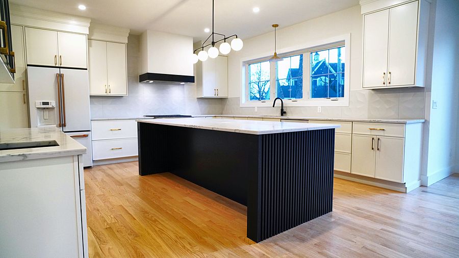 Dove kitchen with a fluted Pitch Black island
