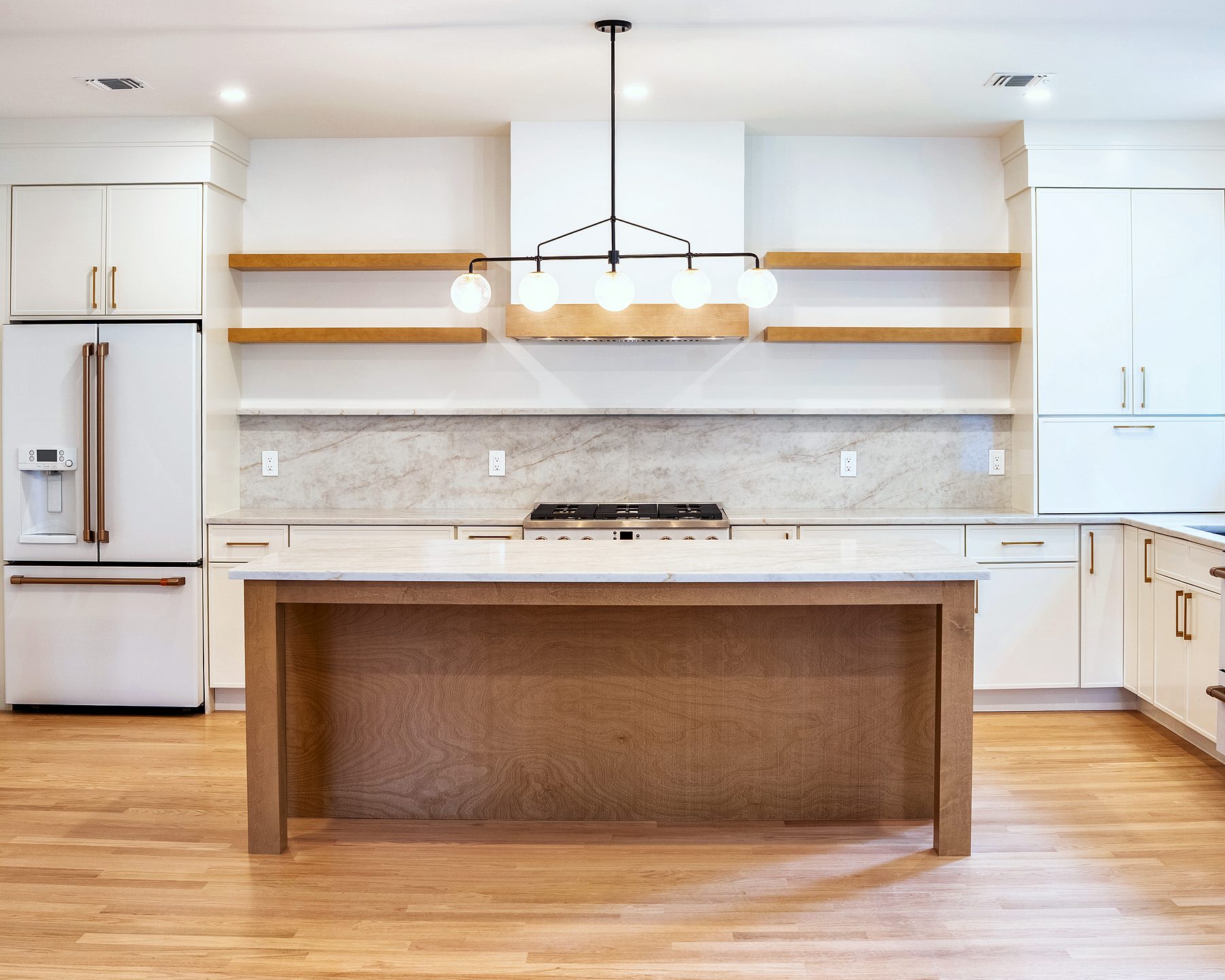 Dove slab kitchen with Timber island, floating shelves and marble-pattern quartz