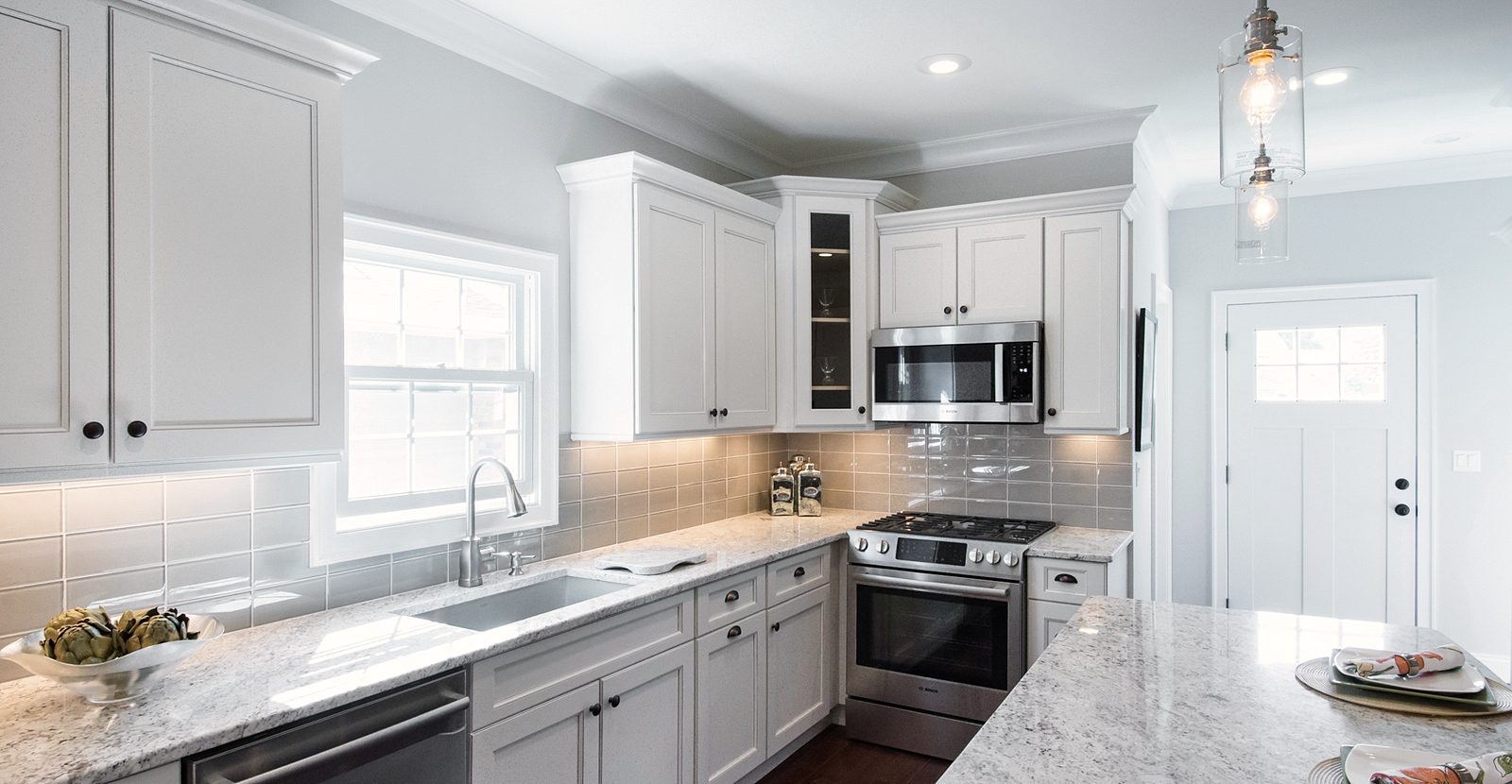 Granite island with seating — Fabuwood Fusion in Blanc with a granite island and an arched hood