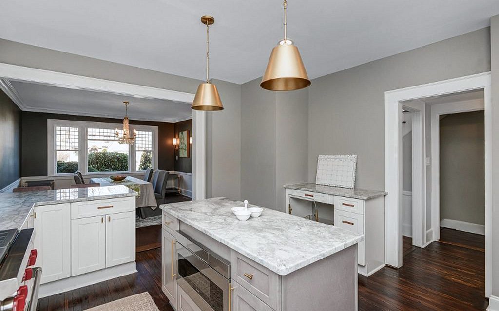 Brass dome pendants — Fabuwood Galaxy Frost and Horizon kitchen with brass dome pendants and arabesque tile