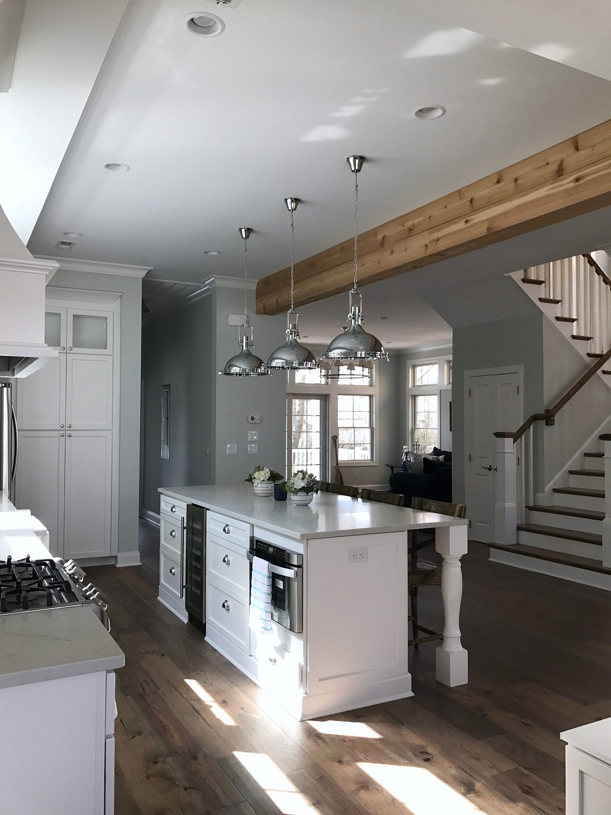 White island with seating — Fabuwood Galaxy in Frost under a beamed ceiling