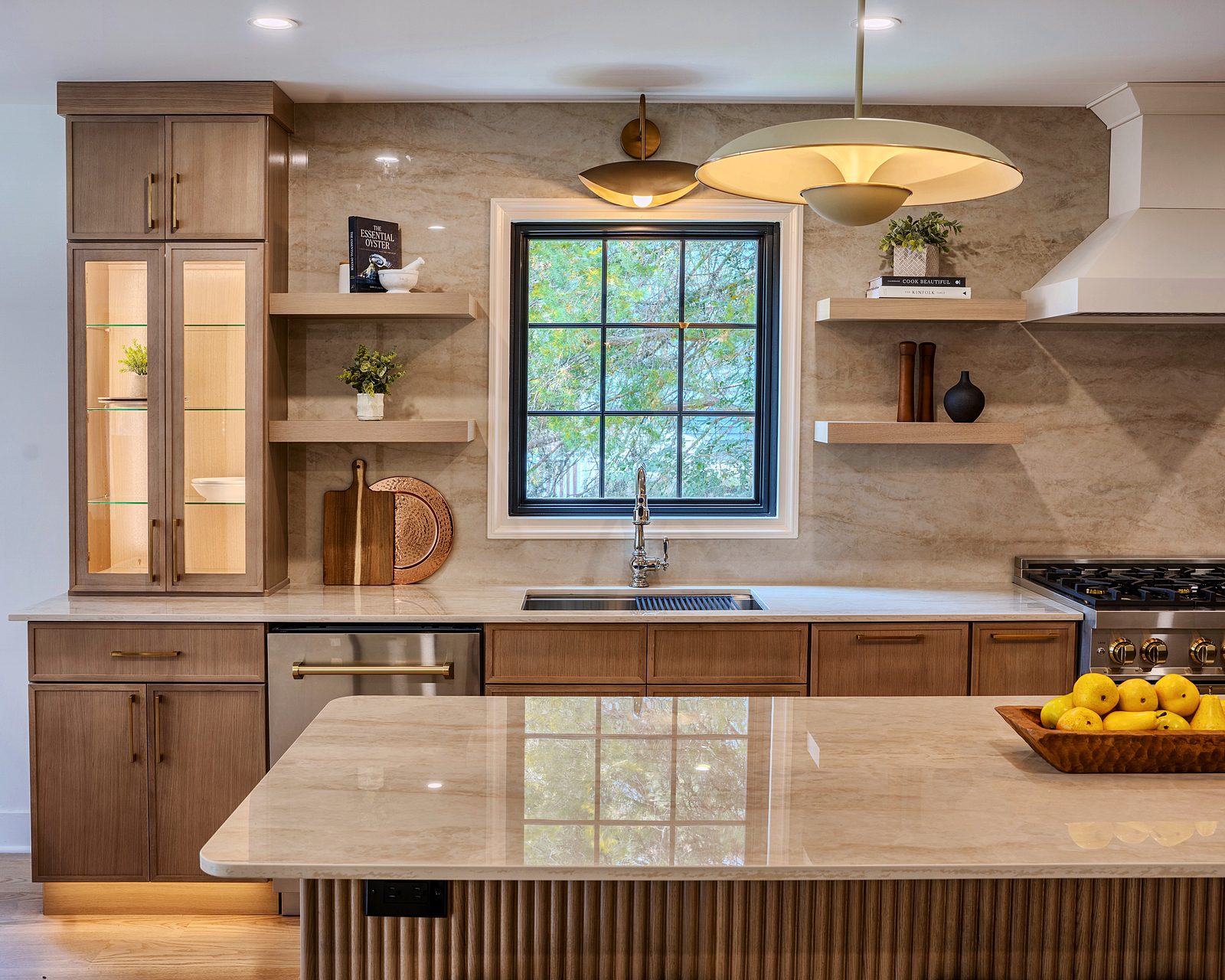 Hood wall with floating oak shelves and brass sconces
