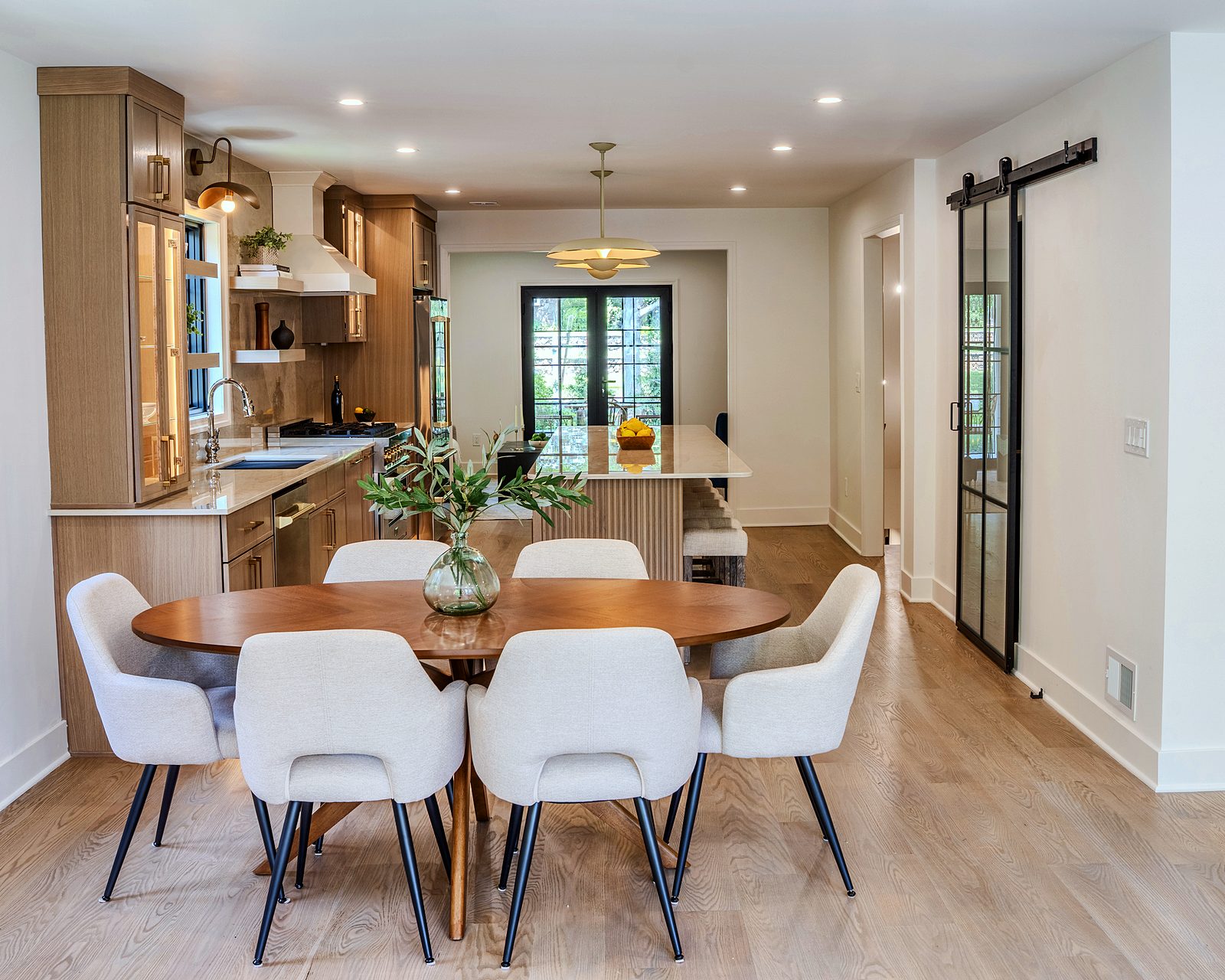 Kitchen open to the dining area with a barn door