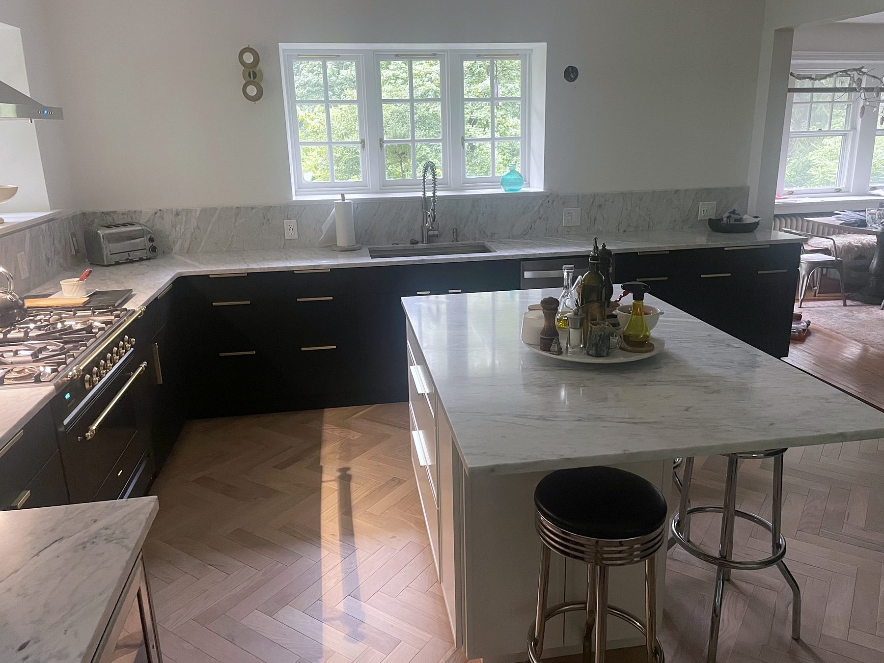 Fabuwood Luna kitchen in matte black with a Dove island and a herringbone floor