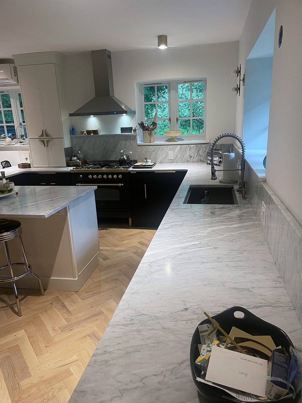 Fabuwood Luna kitchen in matte black with a Dove island and a herringbone floor — photo 8
