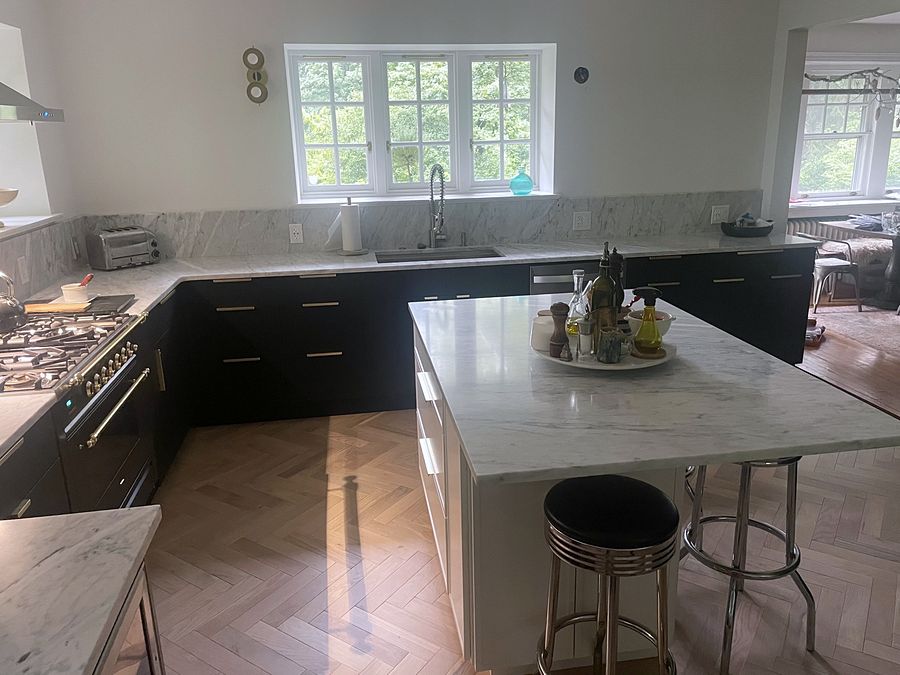 Project 106: Fabuwood Luna kitchen in matte black with a Dove island and a herringbone floor