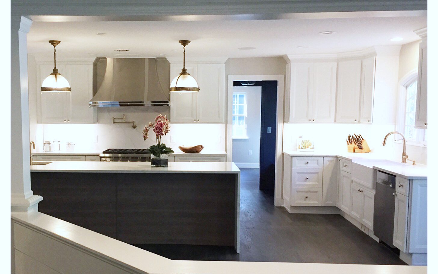 Fabuwood Onyx door, Frost perimeter (archive label) — Fabuwood Onyx Frost kitchen with a gray wood-grain waterfall island