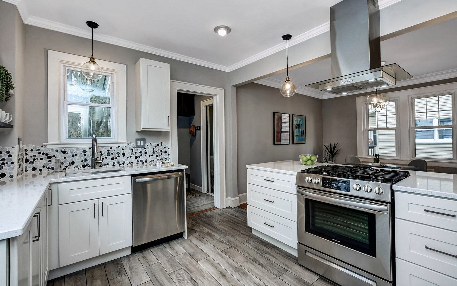 FGM Mercury White perimeter (archive label) — FGM Mercury White kitchen with an espresso island and a mosaic backsplash