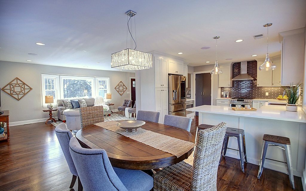 FGM Mercury White kitchen with gray subway tile and an open dining room