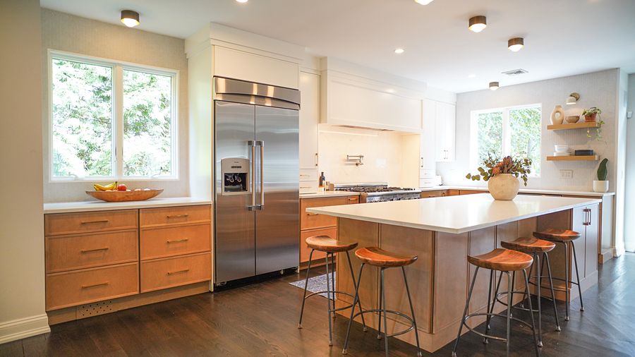 Project 33: Honey oak and white flat-panel kitchen with a charcoal wine bar