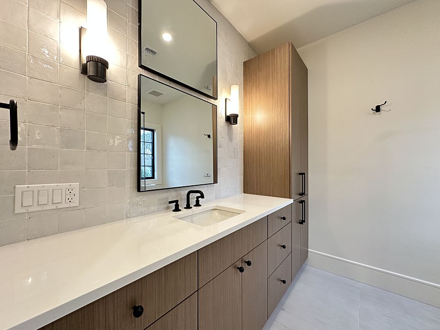 Project 46: Three baths with slab vanities in Paramus