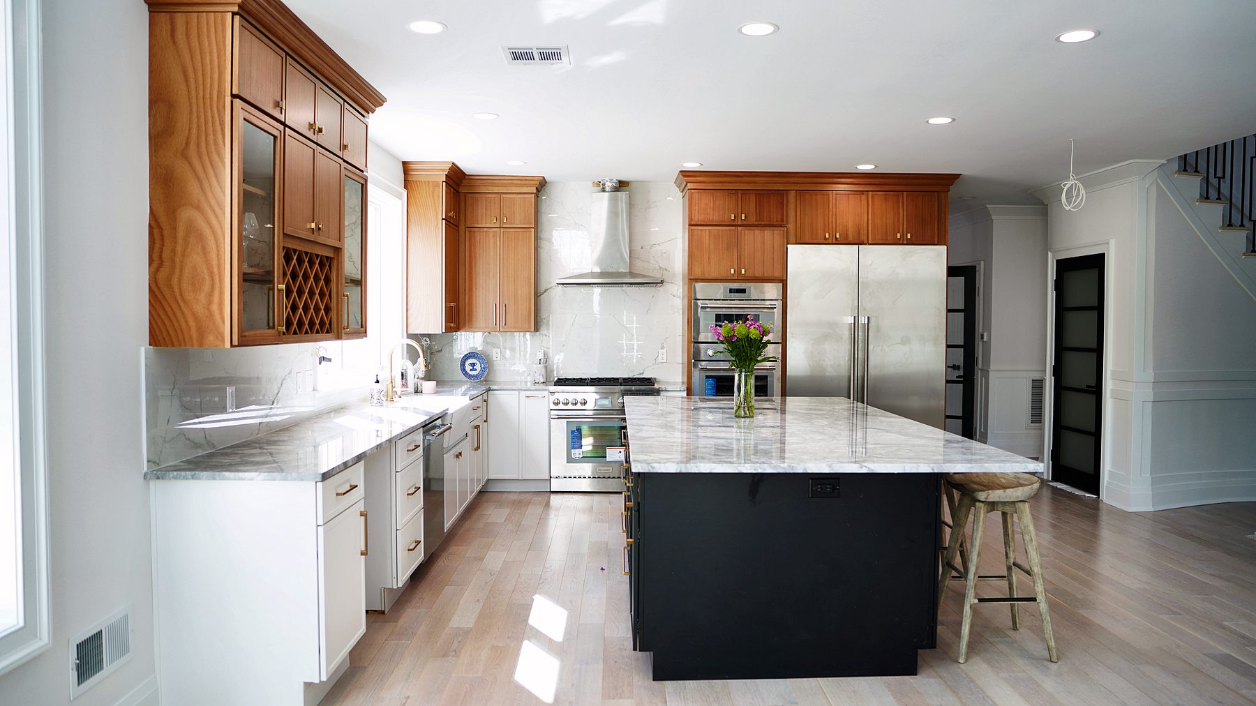 Petit Sand and Petit White kitchen with a Midnight black island