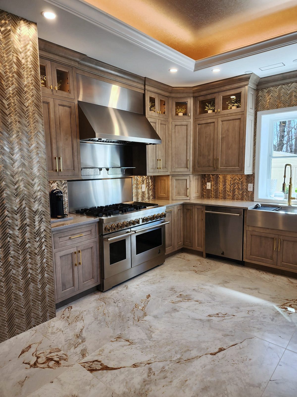 Shiloh Aspen inset door, gray-brown stain (archive label) — Shiloh Aspen inset kitchen in a brown stain with a lit bar wall and a butler’s pantry