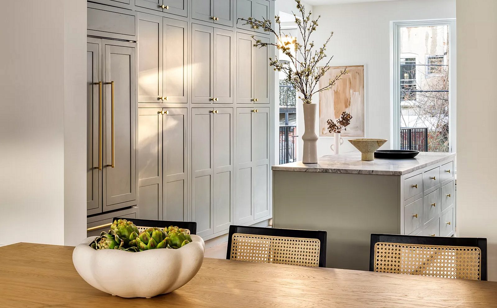 Book-matched marble slab backsplash — Shiloh Hanover inset in Mindful Gray with a marble slab backsplash