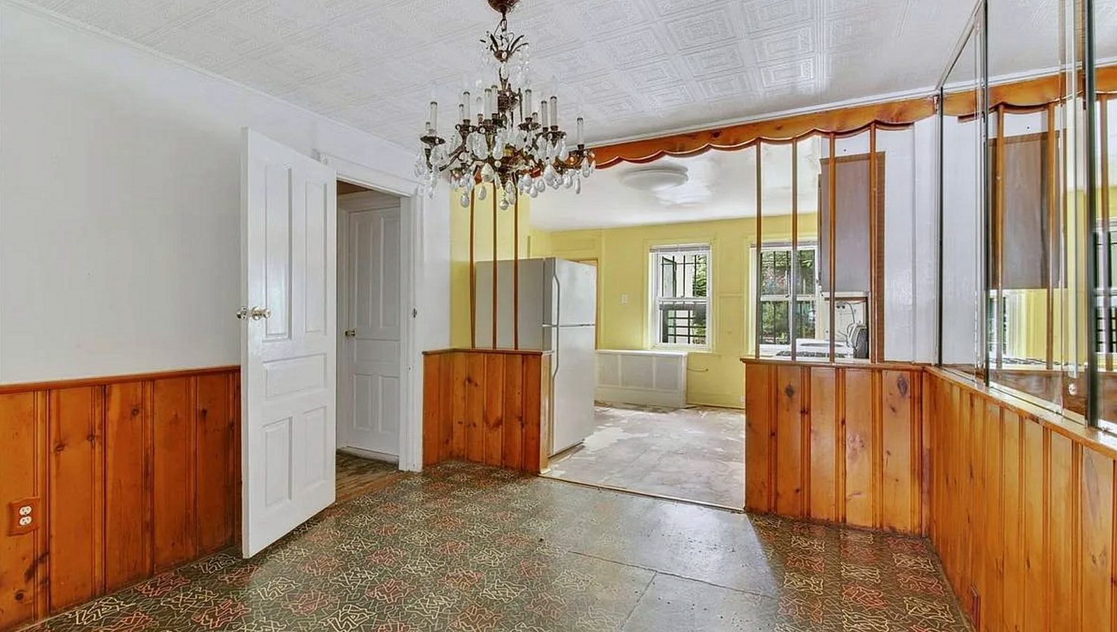 Before: the room as it was, with a pine-panelled wall and a tin ceiling