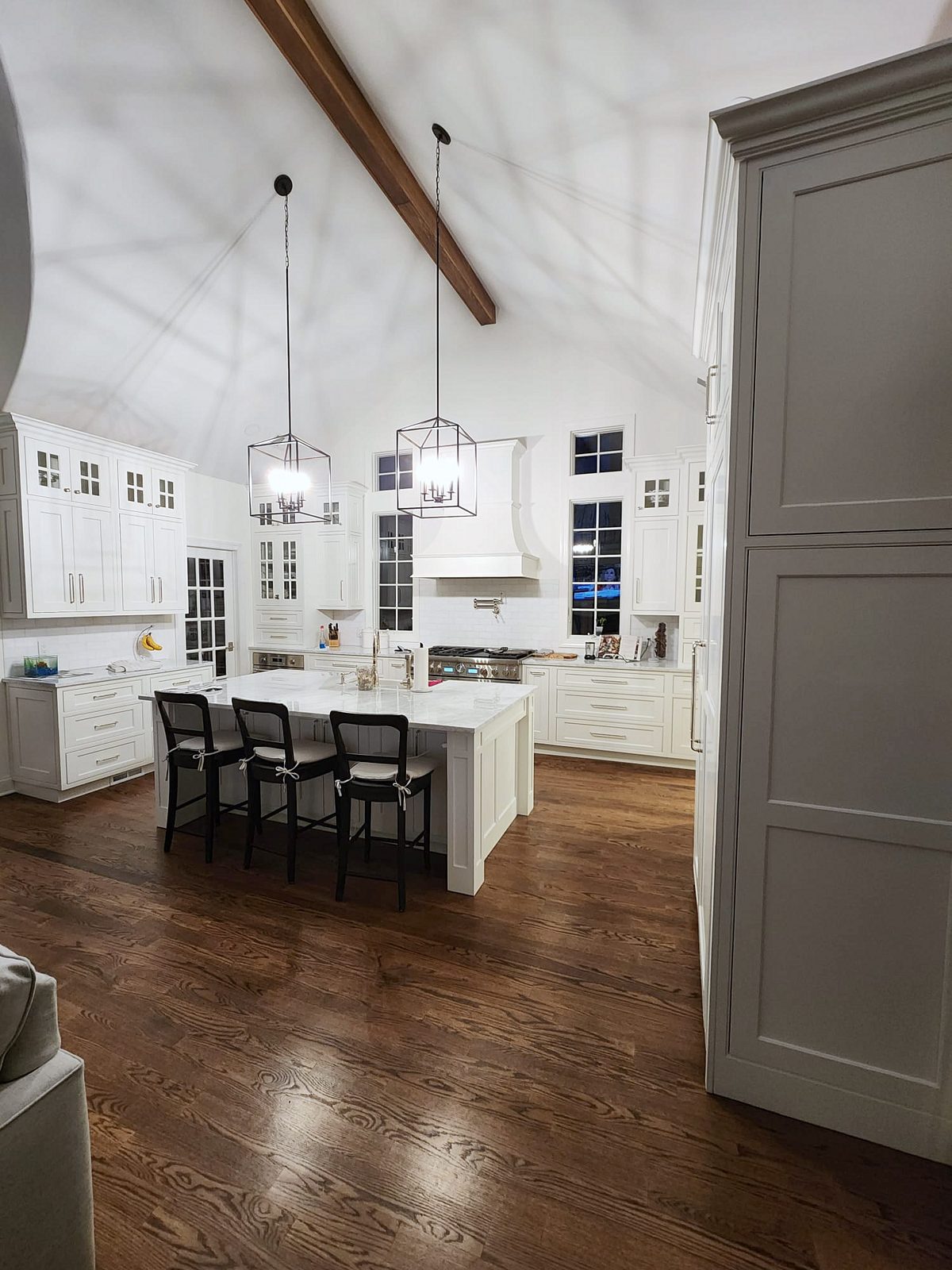 Shiloh Heritage beaded-inset door, white (archive label) — Shiloh Heritage beaded-inset kitchen under a vaulted ceiling with a curved hood