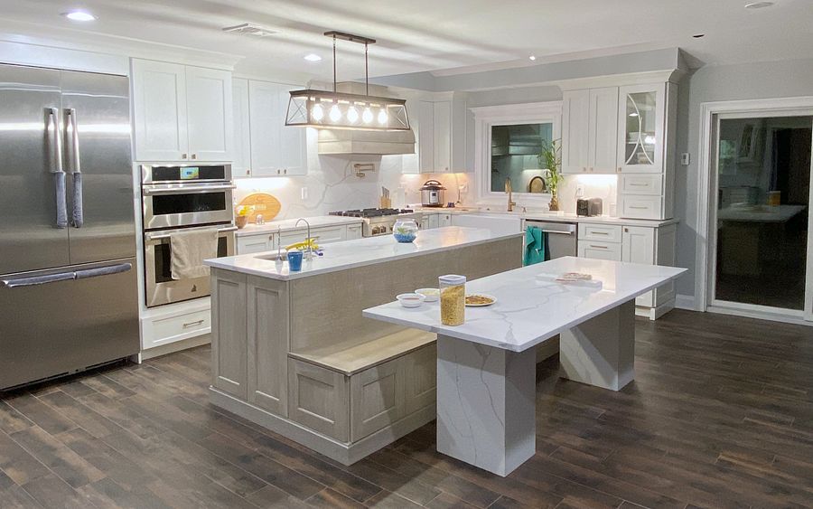 Project 136: Shiloh Heritage kitchen in Polar and Seagull with a bench island and a gray wood hood