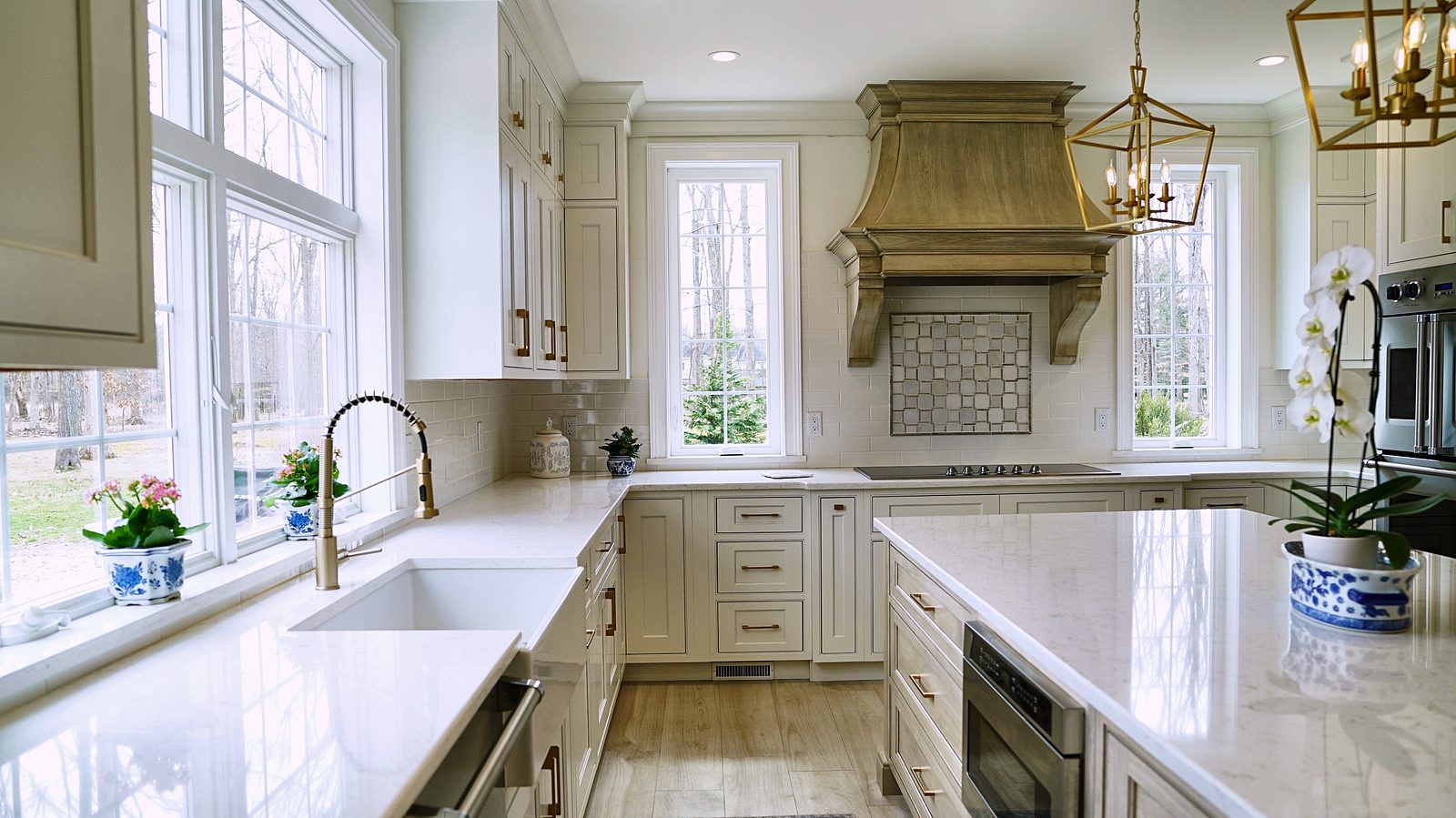 Sink corner with brass faucet and the X-panel island end