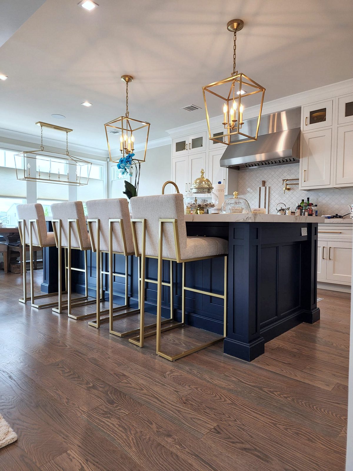 Shiloh inset kitchen with stacked white uppers and a navy island — photo 6