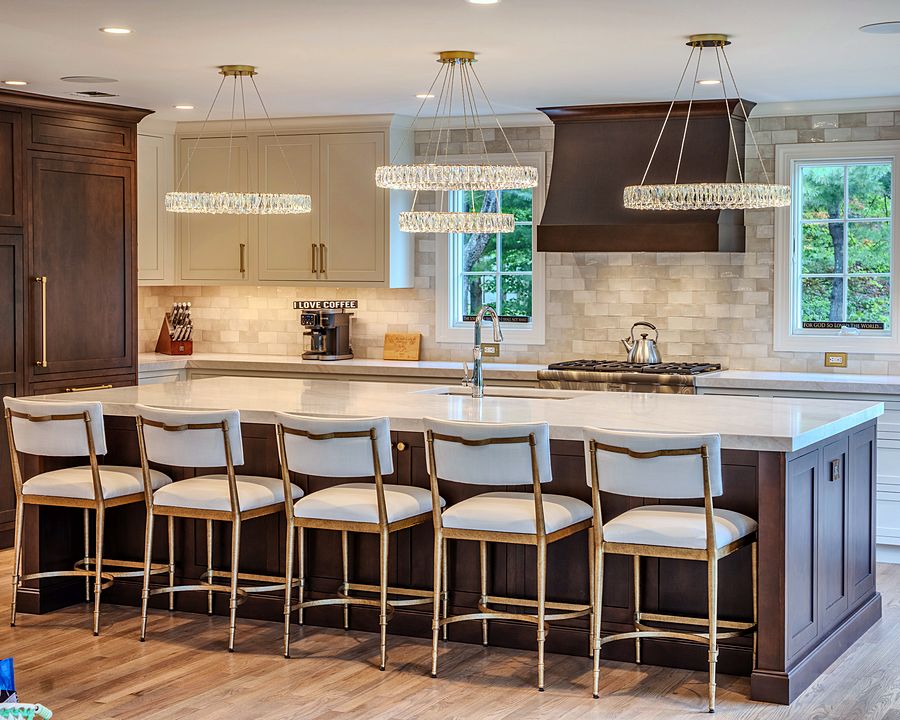 Soft White kitchen with Sable-stained maple island and hood