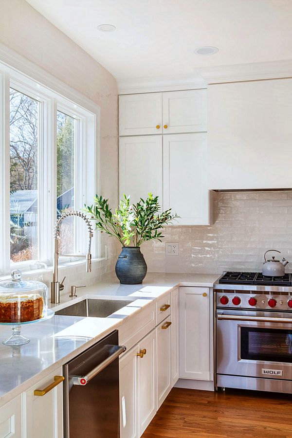 White kitchen with a walnut hutch and two baths, designed with Room Therapy