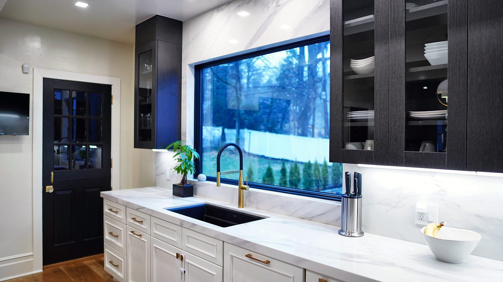 Black-framed glass uppers over the sink