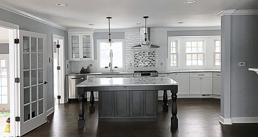 Project 98: White shaker kitchen with a dark gray furniture-style island