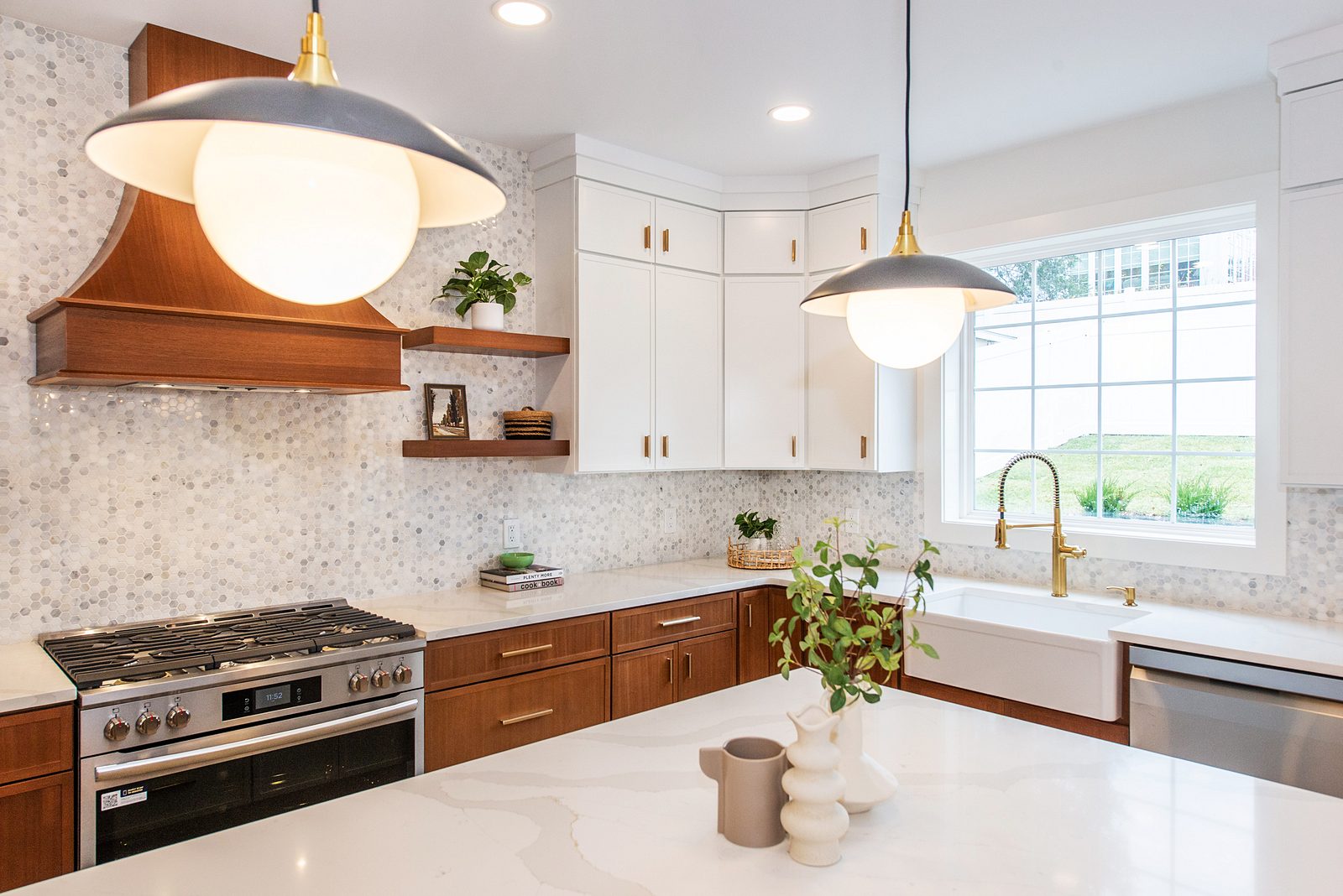 Wood hood, floating shelves and the apron-front sink with a brass faucet