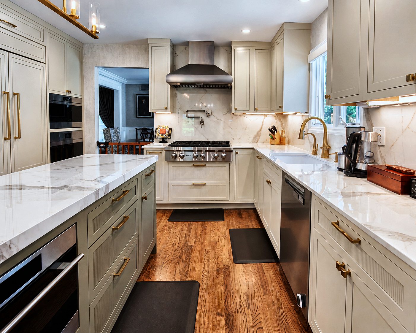 Porcelain backsplash, range and brushed brass pot filler