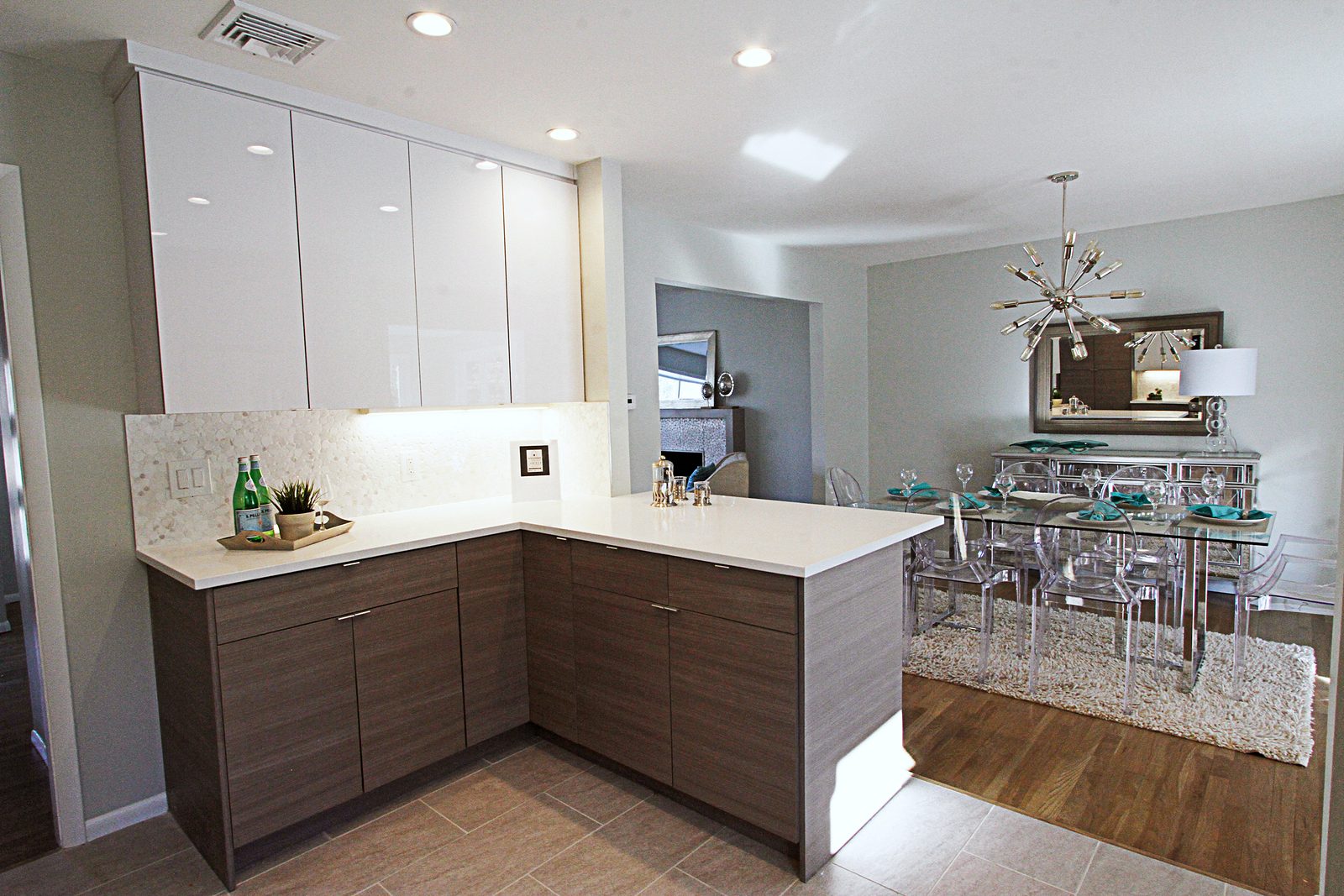 Wood-grain laminate slab tall cabinets — White high-gloss and wood-grain slab kitchen