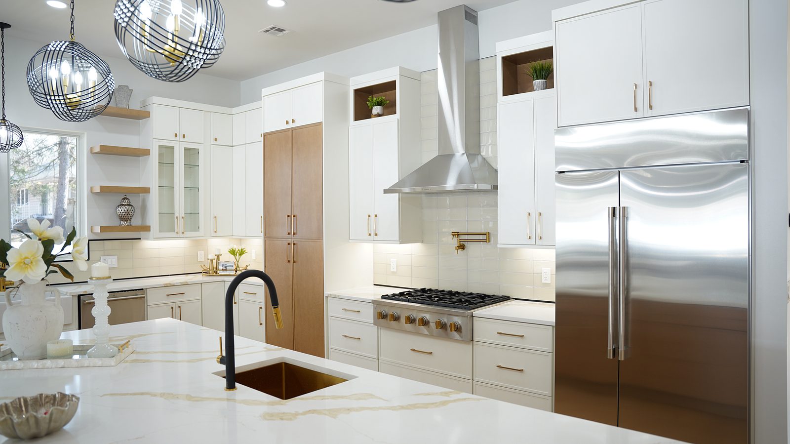 Range wall with the chimney hood and the stainless refrigerator