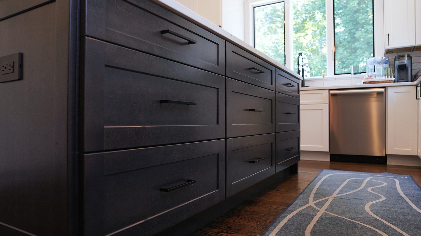 Black shaker island drawers with black pulls