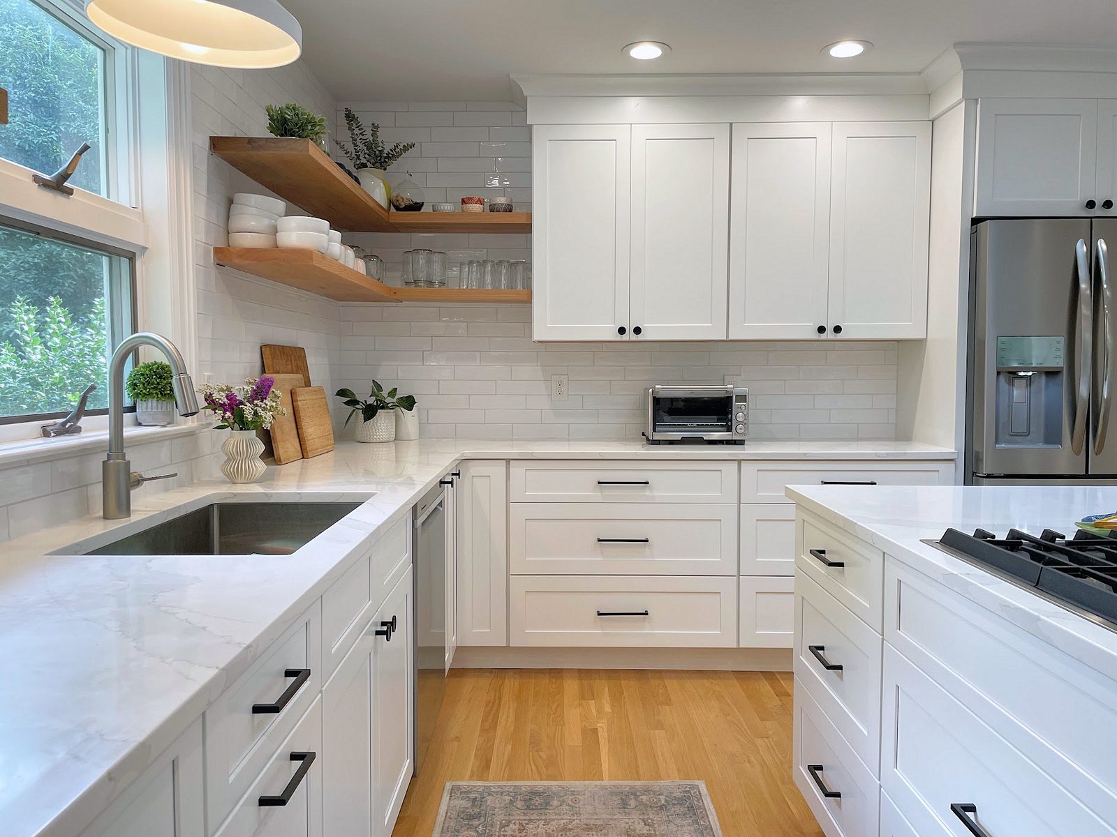 White subway tile to the ceiling — White shaker kitchen with floating shelves and subway tile to the ceiling