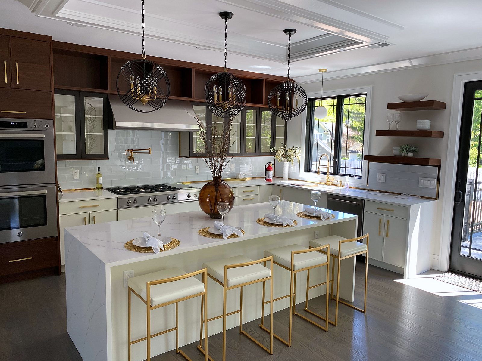 Bellmont Cezanne white slab + Matisse walnut uppers (archive label) — White slab and walnut kitchen with a waterfall island