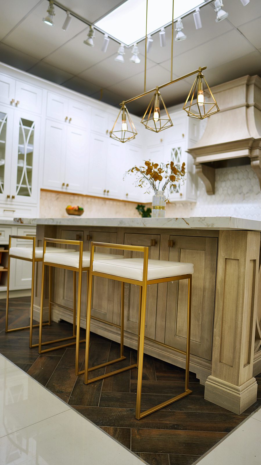 Kitchen display at My House Kitchen — White island with brass stools
