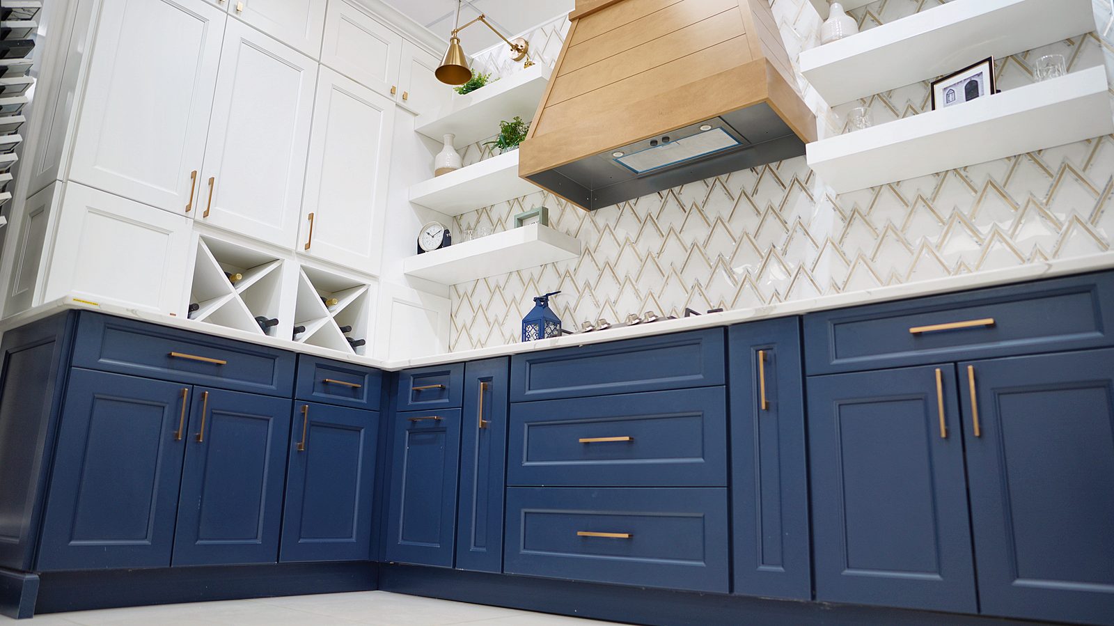 Kitchen display at My House Kitchen — Navy bases with brass pulls